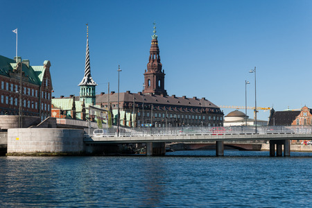 Copenhagen Stock Exchange and Christiansborg Castle at a sunny dayのeditorial素材