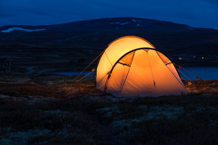 Iluminated tent at night in Norwayの写真素材