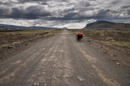 Bicycle on a lgravel road in Icelandの写真素材