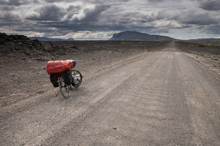 Bicycle on a lgravel road in Icelandの写真素材