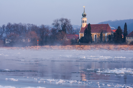 cold sunrise in Dresden with ice floes on the riverの写真素材