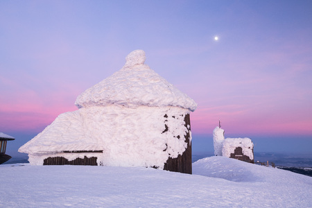 Little Chapel on the Snezka mountainin Czech Republic is glowing in the evening light