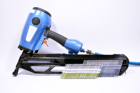 pneumatic air nail gun white background tableの写真素材