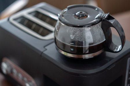 Black plastic and glass automatic espresso machine or coffeemaker top view. Modern Drip Coffee Pot. Electric Kitchen Small ppliance. Domestic and Household Appliancesの写真素材