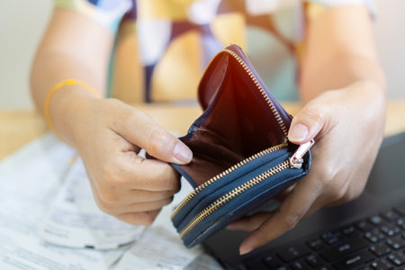 Stressed, Problem business person woman holding and open empty wallet, purse no have money for bill payment, credit card loan or expense. Bankruptcy, bankrupt or debt financial, mortgage conceptの写真素材