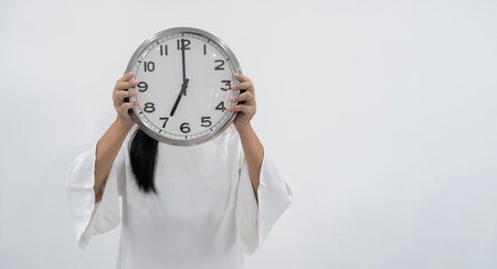 It's 07:00 o'clock. Portrait of charming pretty positive cheerful woman closing covering head face...