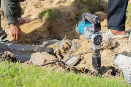 Builder worker with pneumatic hammer drill equipment, construction worker electric drill concrete...