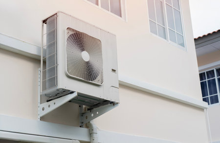 Heat pump or large air conditioning placed on wall of modern house. Energy concept.の写真素材