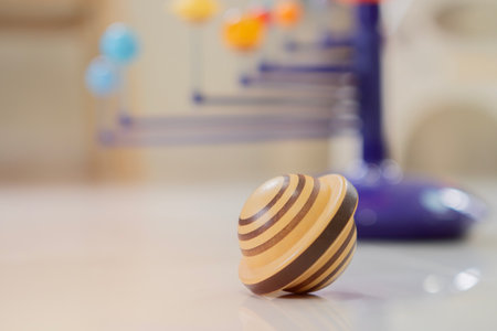 Close-up of wooden Jupiter toy with solar system model. Activity for children concept. Selective...