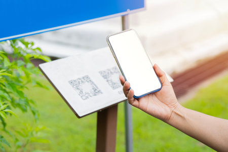People Scan by QR Code connect to mobile application for information at park. Isolate screen, copy space, qr code scan concept.の写真素材