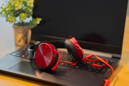Workplace, laptop computer with headphones headset. Business, technology, working from home,...