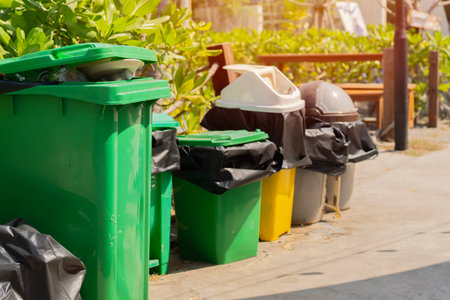 Many trash containers for waste sorting by categories for next recycling on the city street. Waste management, environmental conservationの写真素材