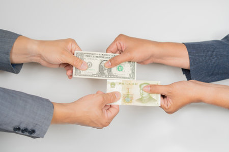 Side view of businessmen change currency make successful deal hold money in hands. Wealth and Exchange conceptの写真素材