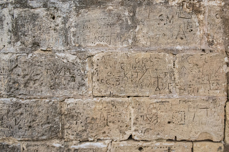 picture of a brick wall with grafities - useable as background or textureの写真素材