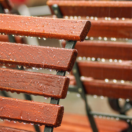 wooden chair at a place restaurants During a showerの写真素材