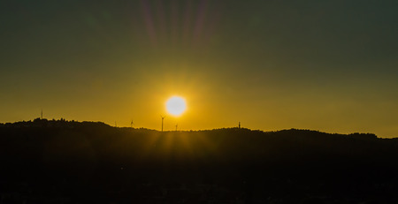 Picture of an impressive sunset over a hillの写真素材