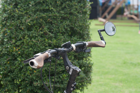 Hand lever straight Mountain bike with mirrors at the ends of the tree. blur.の写真素材