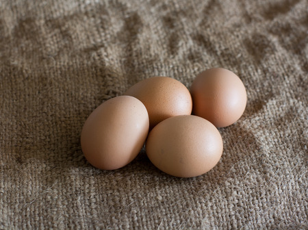Still Life- laying eggs on burlap.
