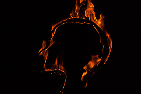 The flame glow isolated black background. Head of Fire. Flames Night Scene.の写真素材
