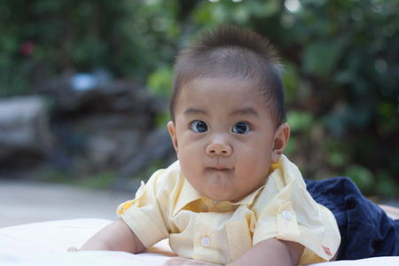 Child development, the lovely boy who is starting to crawling on his seat.の写真素材