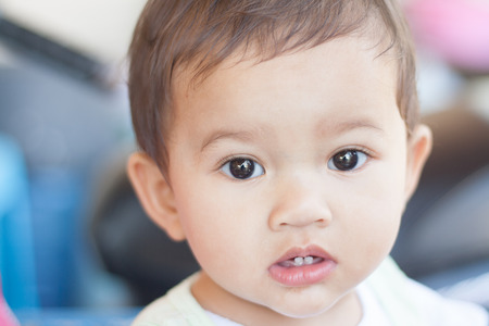 Children aged nine months, the face of Thailand viewed with suspicion.の写真素材