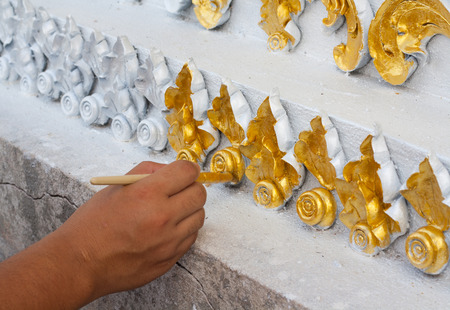 Thailand patterned gold on the temple walls. The art of sculpture.の写真素材
