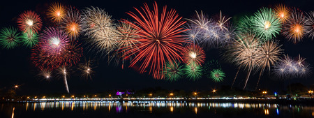 Reflecting on the water surface, work a fireworks display to celebrate great day.の写真素材