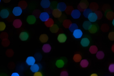 Abstract background of out of focus lights at night. Light hexagon. Blue lights in the dark.の写真素材
