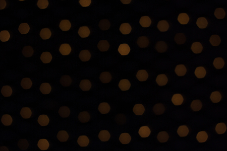 Abstract background of out of focus lights at night. Light hexagon. Light bokeh hexagonal blur.の写真素材