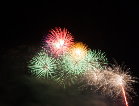 Beautiful fireworks scattered in the dark skyの写真素材