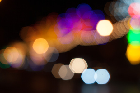 Light green in the dark. Abstract background of out of focus lights at night. Light hexagon.の写真素材