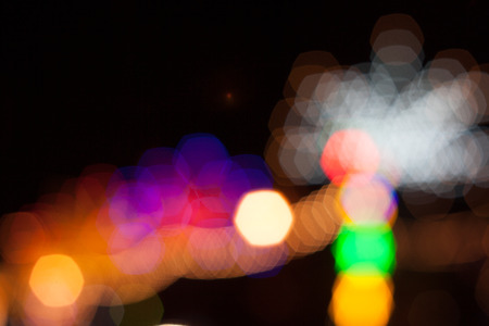 Light green in the dark. Abstract background of out of focus lights at night. Light hexagon.の写真素材