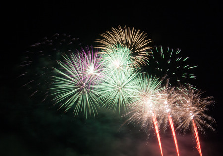 Beautiful fireworks scattered in the dark skyの写真素材
