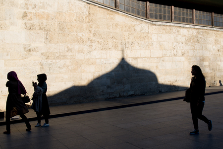 Young muslim women are walking in near the Mosque Istanbul, Turkeyの素材 [FY31078067294]