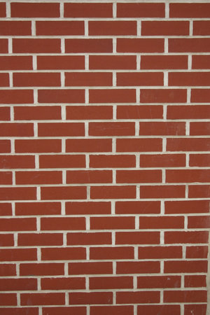 new wall, wall made of red bricks and white grout