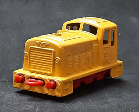 Toy small locomotive yellow metal vintageの写真素材