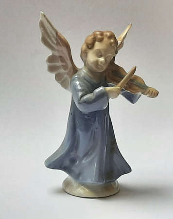 Decoration figure angel porcelain multicolored with violinの写真素材