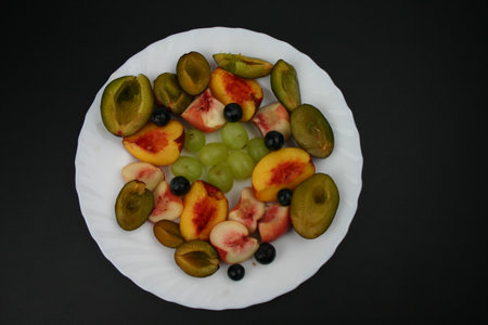 Close up white plate with fruitの写真素材