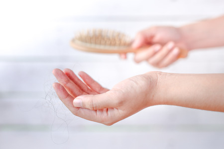 Hairs fall in comb, hair fall everyday serious problemの写真素材