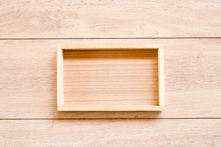 Wooden box on Wood Background, top view.の写真素材