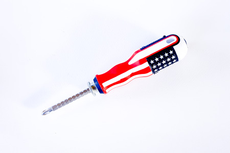 Screw driver isolated on white background. Screw-driver with star and red handle.の写真素材