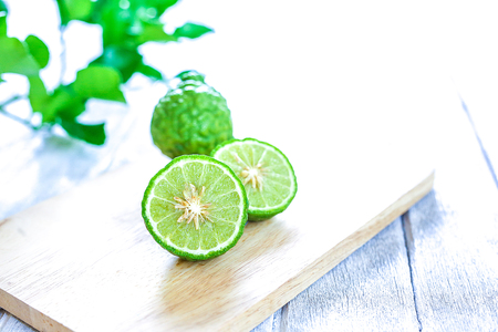 fresh bergamot fruit on wooden table backgroundの写真素材