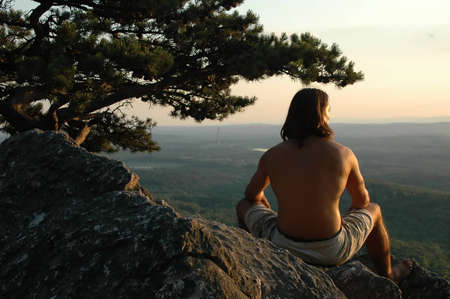 Young man enjoying the view on top of Sugarloaf Mountain in Virginiaの写真素材