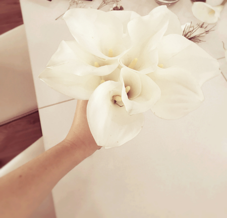 Bride holding wedding bouquetの写真素材