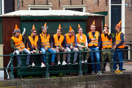 Amsterdam, Netherlands - April, 2018: People on the street celebrate Kings day in Amsterdam city, Netherlandsのeditorial素材