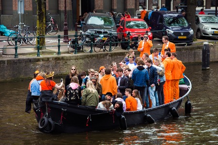 Amsterdam, Netherlands - April, 2018: People on the boat celebrate Kings day in Amsterdam city, Netherlandsのeditorial素材