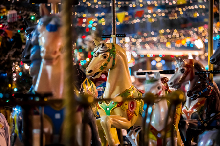Carousel with rocking horses on christmas market in Moscow, Russiaの写真素材
