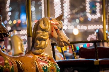 Carousel with rocking horses on christmas market in Moscow, Russiaの写真素材