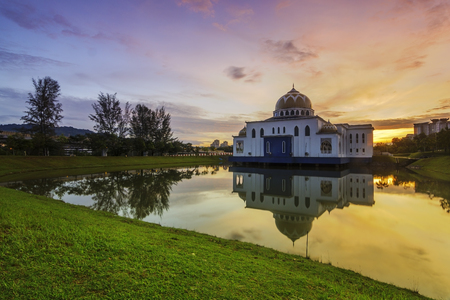 Mosque in nice sunset / sunrise with reflection on lakeの写真素材