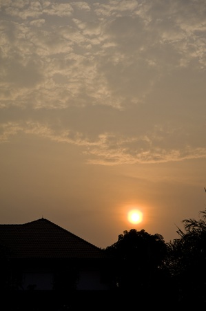 sunset and silhouette roof houseの写真素材